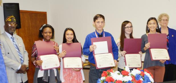 CCLP/BRITTANY FHOLER - Winners of the Patriot’s Pen essay contest and the Voice of Democracy essay contest pose with their certificates at VFW Post #8577 Saturday morning.