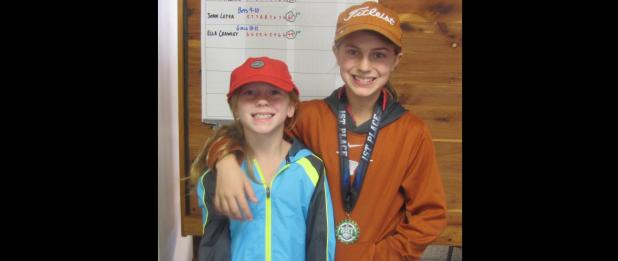 CCLP/PAMELA GRANT - Sisters Maggie and Ella Crawley pose together after participating in the YAC’s first inaugural parent/child golf tournament.
