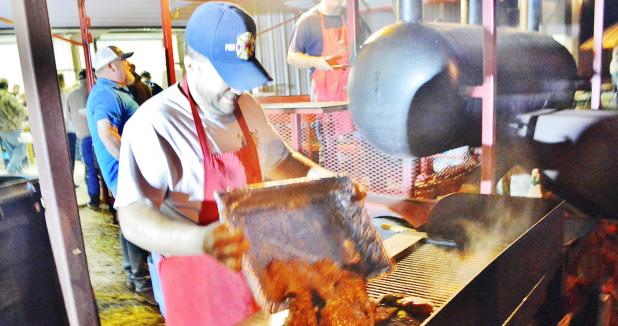File Photo - A fresh batch of seasoned beef is put on the grill during last year’s fajita dinner and auction, held by the Oakalla Volunteer Fire Department. The OVFD is holding the annual event tomorrow night starting at 5 p.m.