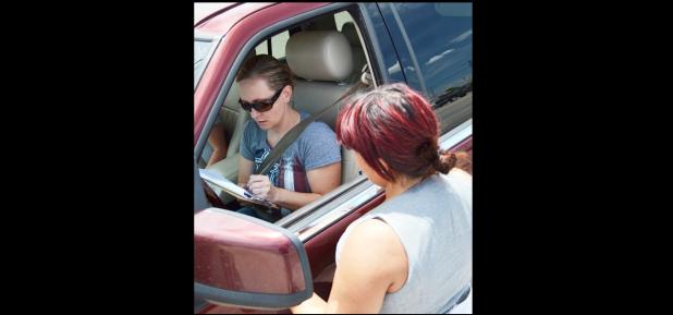 File Photo - A resident signs the liquor petition during a previous year.