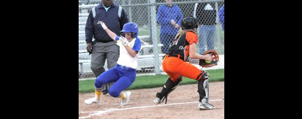 CCLP/TJ MAXWELL - Cove sophomore Addie Cook slides into home plate in front of the tag attempt by San Angelo Central catcher Mickayla Jones during the second inning of the Lady Dawg’s 13-3 mercy-rule win over the Lady Bobcats Tuesday in Cove. Cook was 1 for 3 with a three RBI triple in the fifth inning.