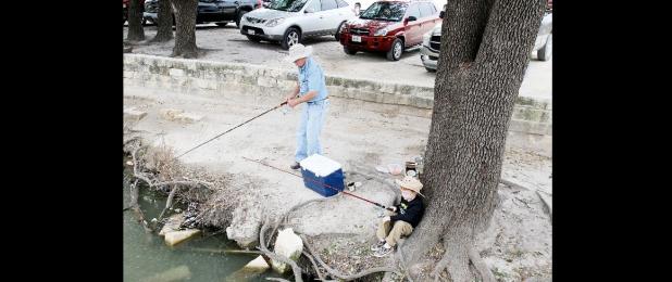 File Photo - Anglers try their luck at the City Park pond. This year’s Fishin’ in the Park is set for tomorrow from 9-11 a.m.