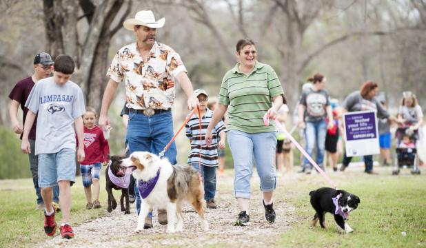 FILE PHOTO - Walkers make their way around the track of the sculpture garden during the inaugural Bark For Life, held in Lampasas. Area dogs and their owners can give the same support by attending Bark For Life in Lampasas on Saturday, an event held by Relay For Life Lampasas-Copperas Cove.