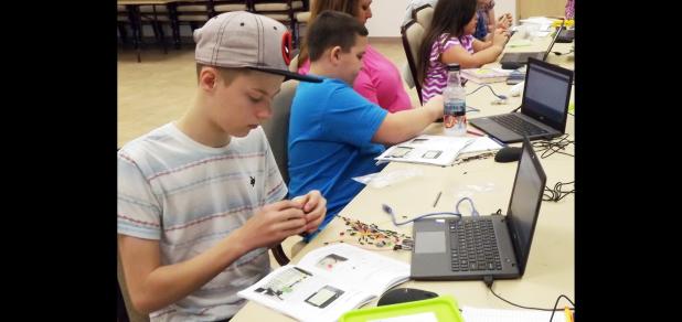 CCLP/PAMELA GRANT- Participants in Evelyn Nelson’s beginner Arduino class begin work on manipulating basic code.