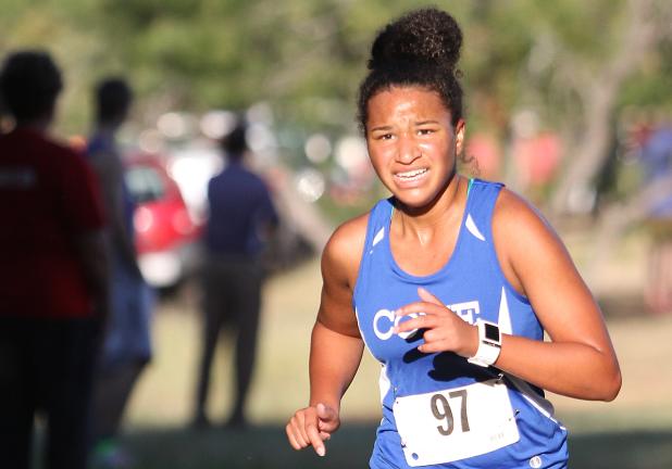 CCLP/TJ MAXWELL -- Cove junior Amber Boyd pushes down the final stretch on her way to a 3rd-place finish at the District 12-6A meet at the Wildflower Country Club in Temple. Boyd has qualified for regionals all three years she has competed.