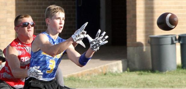 CCLP/TJ MAXWELL - Copperas Cove junior Bryce Ranes looks in a touchdown pass from Jaylen Smith that put the Dawgs ahead 13-0 as Hunter Garrett defends in the final 7on7 tournament of the Centex Passing League season on Monday at Temple High School. Belton rallied to win 20-13. The Dawgs begin their quest for a state crown at the Texas 7on7 Championships beginning Friday in College Station.