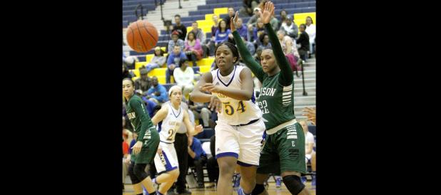 CCLP/TJ MAXWELL - Cove junior Chyanne Chapman kicks a pass out to senior Kaycie Gatewood during the Lady Dawgs’ 48-45 win over the Ellison Lady Eagles on Tuesday. Chapman led the team in points (13), rebounds (6) and steals (4).