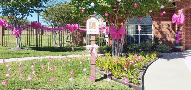 Courtesy Photo - The front lawn and entry of Clear Creek Meadows apartments was decked out in pink for last year’s Pink Out the Town held by Pink Warrior Angels. Registration for the 2016 contest is going on now.