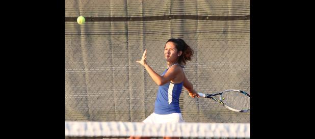 CCLP/TJ MAXWELL - Copperas Cove’s Ashley Martinez reaches back for a forehand during a District 8-5A match against Harker Heights. Martinez helped the Dawgs defeat Shoemaker 14-5 on Tuesday with a 6-0, 6-0 shutout in her singles’ match.