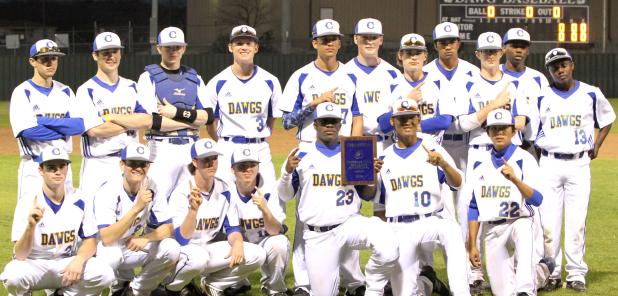 CCLP/TJ MAXWELL - The Cove baseball team poses with the championship plaque after winning their host tournament on Saturday. The Bulldawgs were 4-1 in the tournament to take the crown. The Dawgs have out scored their opponents 60-16 through the first five games.