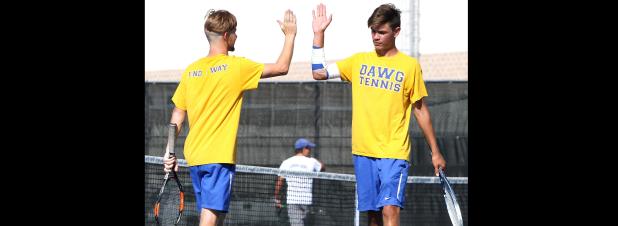 CCLP/TJ MAXWELL - Cove doubles partners Nick Motley, left, and Trystan Jackson celebrate during a match earler in the season. The duo won 2-of-3 doubles matches and 4-of-6 singles matches over the weekend to help Dawg Tennis improve to 14-4 on the season with district play set to start Friday in Killeen against the Kangaroos.