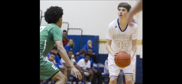 CCLP/TJ MAXWELL - Cove junior Justus Honea spots up for one of his five three-pointers in the Bulldawgs’ 48-46 upset of Ellison on Tuesday. Honea had a game-high 17 points and six assists to lead the way for Cove.