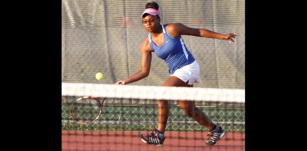 CCLP/TJ MAXWELL - Cove’s Zamira Manuel hits a forehand return during the Dawgs 15-4 loss to Harker Heights on Tuesday in Heights. The Dawgs fall to 18-6 on the season and 1-1 in district play. Cove returns to action today against the Midway Panthers on the road.