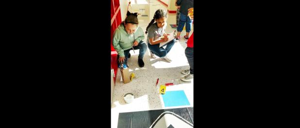 COUTESY PHOTO - Crime scene investigator: Hettie Halstead Elementary students improve their reading skills for the 5th grade STAAR test while working as crime scene investigators during one of the school’s Saturday STAAR Camps. STAAR testing is held at CCISD for elementary schools March 28-29.