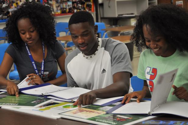 CCHS DECA members Bryiona Whitley, Shomad Lomax and Quiana Whitley evaluate their final presentation on the DECA marketing project they conducted for the Houston Astros that resulted in younger attendance at season home games. The three students are part of a larger group of 35 that qualified for the International DECA Conference by winning the state of Texas and will compete in Florida next week for world honors.