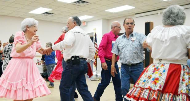File photo - Dancers take to the floor at the Double C’s square dance club 45th anniversary party in April. The club is holding two open houses, on Sept. 13 and 20, with their fall classes to begin Sept. 27.