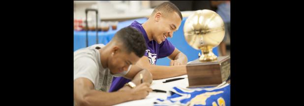 CCLP/DAVID MORRIS - Copperas Cove seniors Devante Robinson, left, and Malyk Thomas participate in a signing ceremony at the high school on Tuesday. Robinson will join former teammate Montre Williams at Division II Northeastern State in Oklahoma. Thomas will play basketball for the NAIA Kansas Wesleyan Coyotes