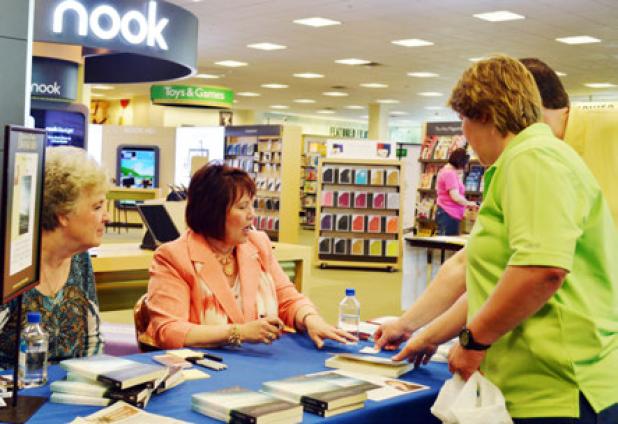 Eva Piper signs a book at Barnes & Noble on Saturday. Piper will return for a one-day ladies’ conference in Killeen on May 3.