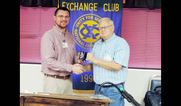 Courtesy Photo Child Abuse Prevention Investigator and Case Worker Torrie White receives an Exchange Club Pen Set from Noon Exchange Club of Copperas Cove President Elect Mike Blount. White served as guest speaker during the Noon Exchange Club of Copperas Cove April 14 Meeting.