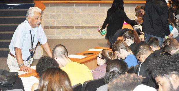COURTESY PHOTO - Fort Hood tax preparer Farley Darbasie explains the history of taxes, how taxes are spent, and how to fill out a tax form to Copperas Cove High School students through a partnership with the DECA program and the Fort Hood Tax Center.