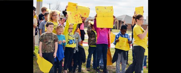 CCLP/DAVID J. HARDIN - House Creek Elementary students hold up signs in support of Connor Hedge during the sendoff rally.