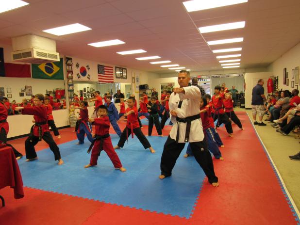 CCLP/BRITTANY FHOLER Copperas Cove firefighter Stephen Clendenen joins his Self Defense America classmates in a demonstration at the ceremony held Friday evening at Self Defense America located in the Cove Terrace Shopping Center. 