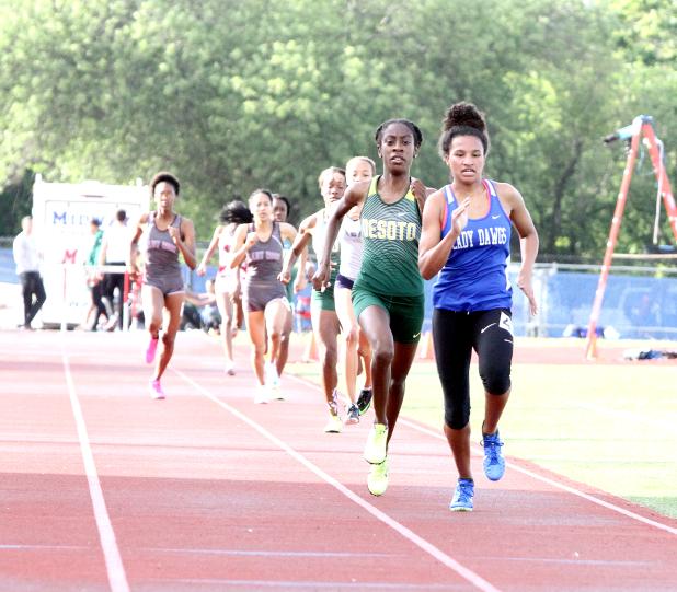 CCLP/TJ MAXWELL ABOVE: Copperas Cove senior Amber Boyd (2:17.76) finishes first in front of Desoto senior Monica Carroll (2:18.41) to earn her first of three Region I-6A berths. Boyd also finished second in the 1,600m run (5:14.05) and fourth in the 4x400m relay (3:58.70) with teammates freshman Anayah Copeland, senior Imari Neal and junior Talia Kinslow. BELOW LEFT: Cove senior Josh Canete competes in the high jump where he set a new personal best mark of 6-feet, 9-inches to win gold. BELOW RIGHT: Cove sen