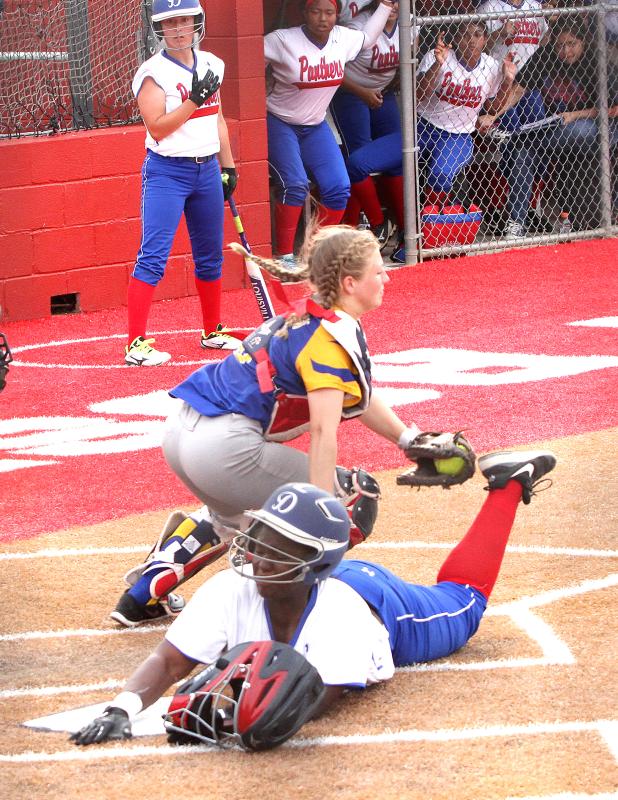 CCLP/TJ MAXWELL Duncanville’s Lauryn Lewis scores under the tag ov Cove’s Rylie Radigan for the first of five third-inning runs for Duncanville.
