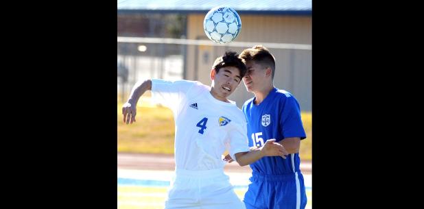 CCLP/LEE LETZER - Copperas Cove’s Issac Griffin (4) hits a header against Temple Tuesday at Bulldawg Stadium in Copperas Cove.