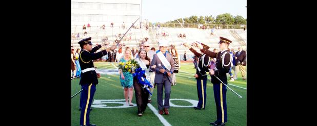 CCISD/Courtesy Photo - The Copperas Cove High School JROTC Saber Team uses its sabers to form an arch under which the newly crowned homecoming queen and king, Skye Richard and Juston Case, pass. The saber arch is a military tradition typically used to introduce a new couple to the community.