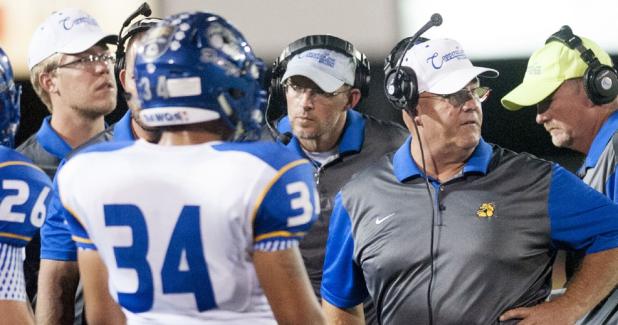 CCLP/TJ MAXWELL - Copperas Cove head coach Jack Welch, second from right, will lead his team into battle in the regular season finale against Belton. The Dawgs must beat Belton to make playoffs for 13th-consecutive year.