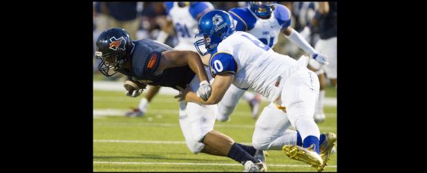 CCLP/STEVEN DOLL - Cove senior defensive tackle James Vernardos sacks Garland Sachse quarterback Jalen Mayden during the Dawgs’ 48-16 loss. The Dawgs’ defense will need to slow down the Midway Panthers’ powerful offense to come away wth a win.