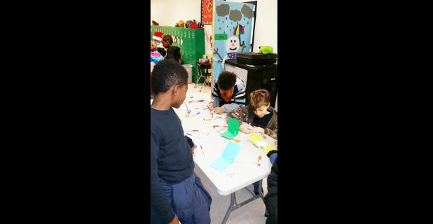 Courtesy Photo/CCISD - Fairview/Miss Jewell Elementary fifth graders Nakeem Freeman, Jayden Jubilee and Daniel Smith work on creating pop-up cards after studying work of illustrator Robert Sabuda. Classes at every grade level celebrated reading campus-wide through 12 different creative stations.