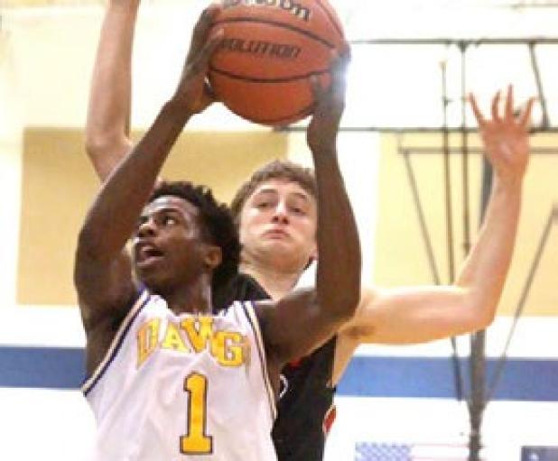 Cove’s Jordan Woodberry streaks to the basket against Lake Travis on Monday. The Bulldawgs went 1-1 in the two-game home stand on Monday and Tuesday.