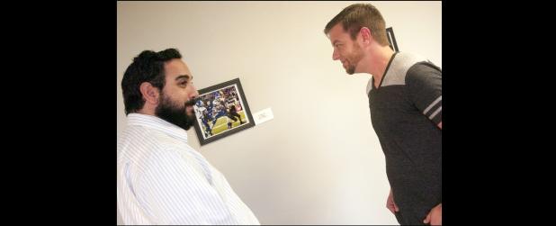 CCLP/DAVID MORRIS - Josh Quinn, right, chats with a visitor to his gallery during the artist reception, last Thursday at the Oveta Culp Hobby Memorial Library at Central Texas College.
