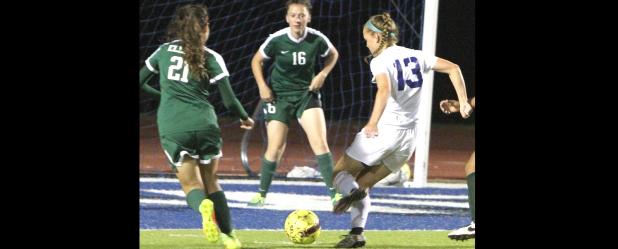 CCLP/TJ MAXWELL - Cove junior Kailey Walker takes a shot on goal in the first half of the Lady Dawgs’ 1-0 loss to Ellison. Lady Eagles Britney Guerrero and Kennedi Lewis defend on the play.