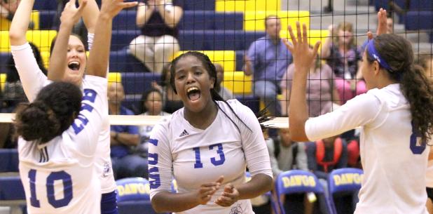 CCLP/TJ MAXWELL - Lady Dawgs, from left, Kiarraj Carlisle (10), Brinna Acker, Chyanne Chapman and Aidan Chace celebrate a Chapman block that ended their five-set match against Liberty Hill on Tuesday. The Lady Dawgs won (26-28, 21-25, 25-17, 25-19, 15-9).