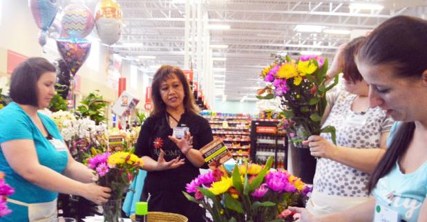 CCLP/LYNETTE SOWELL - Maggie Honea with the H-E-B Plus! Floral Department gives flower arranging tips during Tuesday morning’s Military Spouse Makeover held at Copperas Cove H-E-B Plus!. The event was sponsored by H-E-B and the USO Fort Hood.