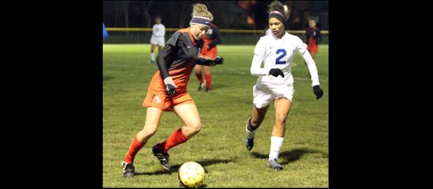 CCLP/TJ MAXWELL - Belton junior Mattie Krenek attempts to drive past Cove junior Jordan Campbell during the Lady Tigers 9-1 win over the Lady Dawgs Tuesday night in Cove. The Lady Dawgs fall to 3-3-2 with the loss while the Lady Tigers remain undefeated in 12-6A play at 7-0-1.