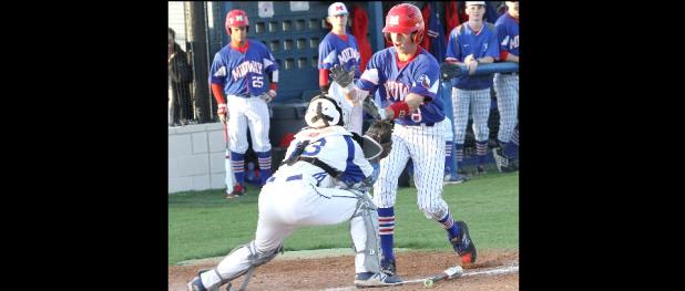 CCLP/TJ MAXWELL - Cove catcher Michael Goudeau tags out Midway’s Couper Cornblum in the first inning of their 8-6A clash on Tuesday.