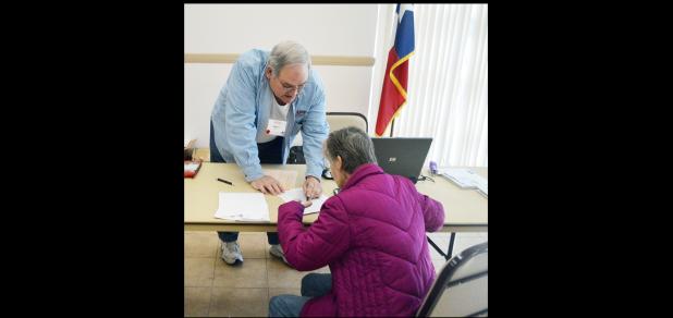 CCLP/LYNETTE SOWELL - Mike Delaune, a certified tax aide with AARP, helps prepare taxes on Wednesday at the Copperas Cove Public Library.