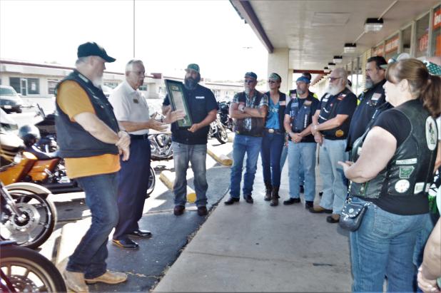 CCLP/LYNETTE SOWELL Copperas Cove Mayor Frank Seffrood talks about a city proclamation for Motorcycle Safety and Awareness month on Friday afternoon in front of Frames & Things in Cove Terrace Shopping Center. Robert Weidinger II, owner of the shop and a member of Boozefighters Club chapter 78, hosted a gathering of motorcycle club representatives to receive the proclamation from Seffrood. 