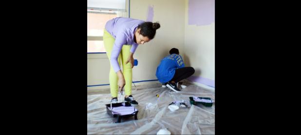 CCLP/LYNETTE SOWELL - Niomi Charmant and Deon Williams paint the walls in what will soon be the store called Thanks For The Little Things, run by their grandmother, Patricia Johnson. The shop on 412 E. Ave. D will offer children’s clothing, shoes and more for donations.