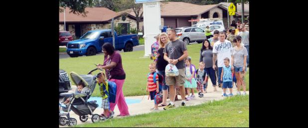 CCLP/LYNETTE SOWELL - Parents and students move in line toward Mae Stevens Early Learning Academy on the first day of the new school year. CCISD had 7,757 students enrolled as of the start of school on Monday, with the freshman class numbering 642 at CCHS, its highest first-day enrollment ever.