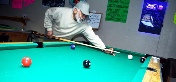 CCLP/LYNETTE SOWELL - Richard Session, owner of Kletus Rack Room, lines up a shot at the pool room he and his wife operate. The pair want to provide a place for families and friends to gather for pool, games, as well as hosting parties.