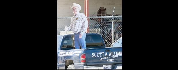 CCLP/DAVID MORRIS - County sheriff candidate Scott Williams has a cardboard presence not far from the annex in Gatesville.