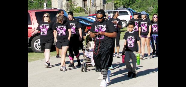 CCLP/PAMELA GRANT - Participants in Team J. Lyons’ Walk For Lupus start their 5k run on Saturday at Ogletree Gap Park.