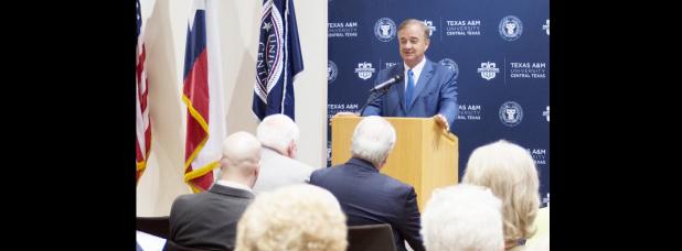 COURTESY PHOTO - Chancellor John Sharp of the Texas A&M University System speaks at the signing of an affiliation agreement between the university and the Executive Director of the Center for Solar Energy.