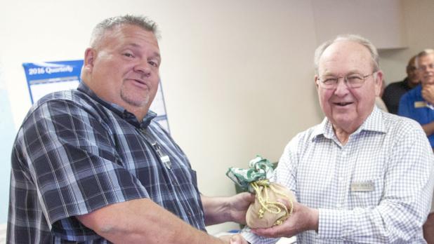 CCLP/LYNETTE SOWELL - Tom Boren is shown making a past donation to the Cove House. Boren sold Western Insurance to Bill Kliewer with BKCW Insurance who now owns the agency. Boren will still work there in a part-time role.