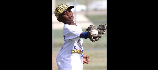 funCCLP/ TJ MAXWELL - Tre’ Boyce looks a ball into his glove Wednesday during catching drills as part of the annual Bulldawgs Baseball Camp. Boyce is one of over 50 players to attend the camp